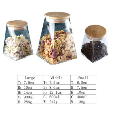 China Wholesale New Design Freshness Preservation High Borosilicate Glass Food Storage Jar With Wooden Lid Food Container Sealed Glass Jar for sale