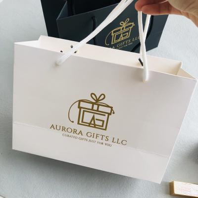 China Hot Selling Custom Recyclable Logo Printed Foiled Stamping Paper Bag For Clothing And Gift for sale