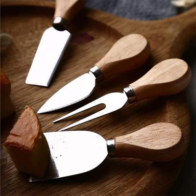 China Wood+Stainless Amazon Steel Manual Part 4 Pieces Small Cheese Slicer Set Kit Stainless Steel Cheese Knife Set Wooden Cheese Cutters for sale