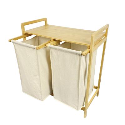 China Transitional Home Decor 2 Bags Bamboo Laundry Hamper With Storage Shelf for sale