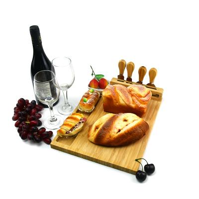 China Large Sustainable Bamboo Cheese Board And Knife Set Custom Wholesale Cheese Cutting Board With Cutlery Rack for sale