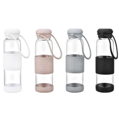 China Sustainable Creative Outdoor Sports Bottled Glass Water Bottle With Silicone Sleeve And Cord for sale