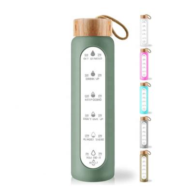 China Sustainable High Quality Reusable Custom Wooden Logo Glass Water Bottle 1000ml Glass Bottle Lid Tumbler for sale