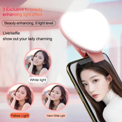 China Photographic Selfie Fill Light Equipped Set Camera Mobile Phone Led Portable Selfie Ring RK47s Lightweight Heart Selfie Rechargeable Light for sale