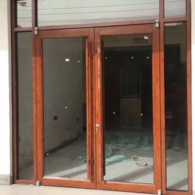 China Waterproof Asian Top Brand Aluminum Glass Ground Double Swing Door for sale