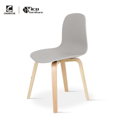 China Other Modern Design Plastic Dining Chair With Wooden Legs for sale