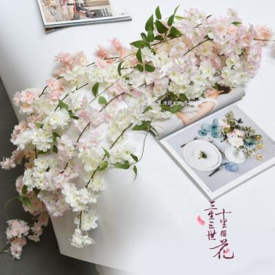 China Single Flower Decoration Artificial Flower Garland 1.8m Cherry Blossom Wreath Home Decoration Popular Wedding Holiday Decoration for sale