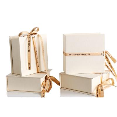 China Recycled Materials Special paper custom logo earring ring necklace bracelet gift package luxury box jewelry box with ribbon closure for sale