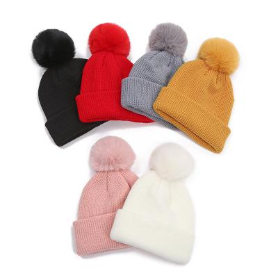 China COMMON C108099 Kids Solid Christmas Hat Boys Winter Hat 2021 Hot Fashion Girls Knitted Hat With Plush Ball for sale