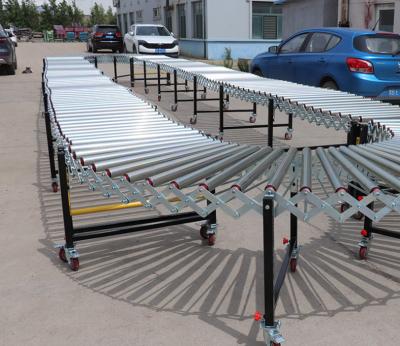 China Heat Resistant 304 Stainless Steel Skate Wheel Gravity Roller Conveyor Machine for sale