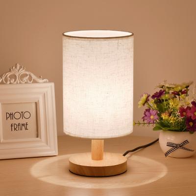 China Linensolid Wooden Small Table Bedside Lamp DIY Wooden Small Bedroom Canvas Bedside Lamp Manual Embossed Fabric Cover Table Lamp for sale