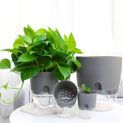 China Modern Wholesale 2 Tier Modern Cheap Plastic Planter Self Watering Plant Indoor Decorative Large Pot for sale