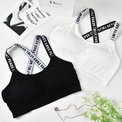 China Women Yoga Fitness Stretch Workout Tank Top Sports Antibacterial Seamless Padded Bra With Letters Straps for sale