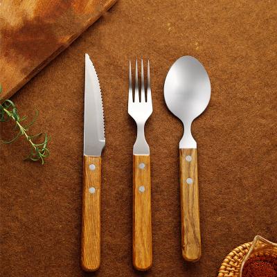 China Stocked Wooden Handle Stainless Steel Cutlery Set Forks Spoons Knives Flatware Set for sale