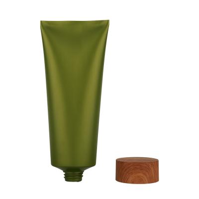 China Customized Widely Used Green Black Facial Detergent Skin Care Cosmetics Plastic Tube With Screw Cover Bamboo Lid for sale