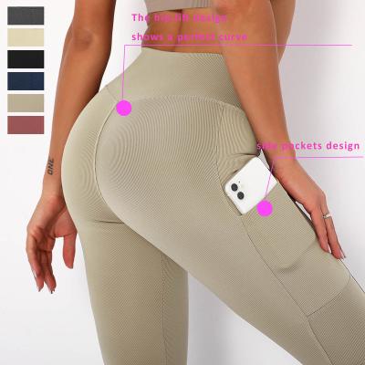 China 2021 Hot-selling Seamless Athletic Quick-drying Butt Lift Breathable Yoga Pants Pocket Fitness Yoga Leggings Side Gaiters for sale