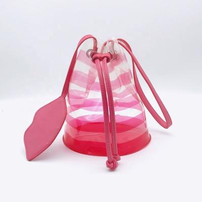 China Best Selling Fashionable EVA Pink Striped Transparent Jelly Bag Bucket Shoulder Bag With Lip Shape Small Pocket for sale