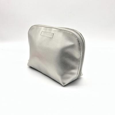 China Fashionable Logo Women's Debossed Travel Cosmetics Storage Pouch Holographic PU Leather Silver Color Cosmetic Bag for sale