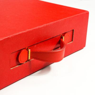 China Custom Logo Luxury Cardboard Red Color Folding Magnetic Gift Boxes With Leather Ribbon for sale