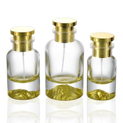 China Eco-Friendly Recyclable Unique Gradient Gold Thick Bottom Empty Cylinder Spray Perfume Perfume Bottles With Paper Tube for sale