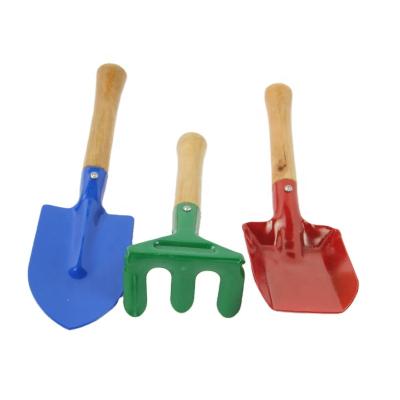 China Gardening/Beach Playing Wholesale 3 Pieces Real Kids Garden Safe Colorful Rake Shovel Trowel Tool Kit With Wooden Handle for sale