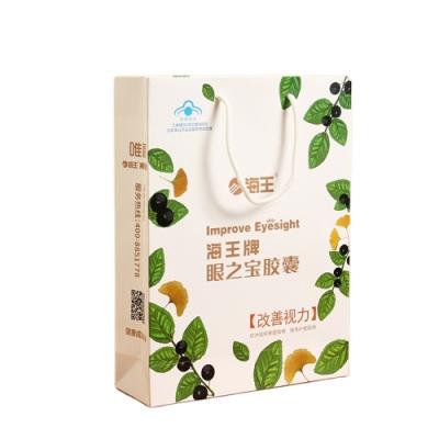 China Good Quality Recyclable White Custom Logo Cardboard Paper Bags Hot Selling Luxury Packaging for sale