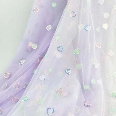 China Anti-static iridescent color sequin embroidery heart design hameleon two tone crystal sequin fabric for sale