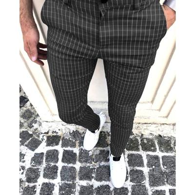 China Polyester/cotton men's slim fit small foot casual pants lace up striped pants fashion plaid elastic skinny pants men for sale