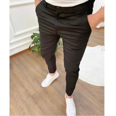 China Fashion Small Medium Thin Casual Pants Solid Color Polyester/Cotton Men's Fit Feet Waist Elastic Men's Tight Pants Shapes Tight Skinny Men for sale