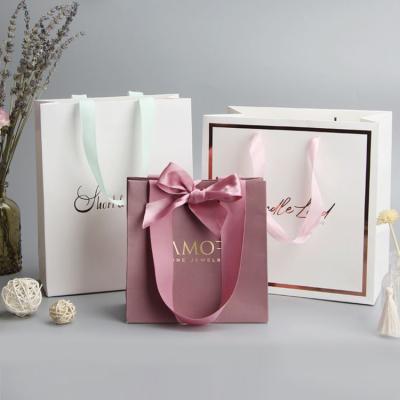 China Recycled Materials Wholesale Custom Printed Gift Luxury Shopping Paper Bag With Handle for sale