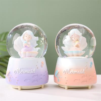 China Global Wholesale Ocean Heart Pearl Girl Mermaid Snow Music Lantern Crystal Ball Music Box Desktop Shell Ornament for sale