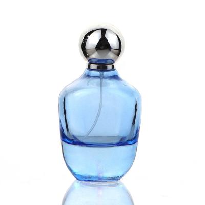 China Cosmetic Transparent 100ml Blue Colored Empty Perfume Packaging Bottle With Silver Spray Pump Cap for sale