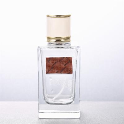 China 100ml cosmetic 100ml square clear empty glass bottle perfume packaging for sale for sale