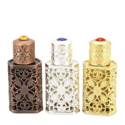 China 3ml Middle East Dubai Metal Perfume Oil Bottles Luxury Arabic Cosmetic Glass Stick Bottle For Essential Oil for sale