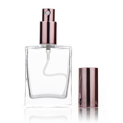 China Empty Square 50ml Cosmetic Perfume Clear Glass Bottle With Rose Gold Mist Spray Cap 50ml for sale