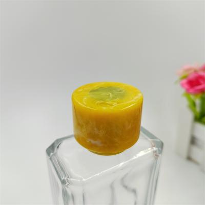 China Non Spill Luxury Perfume Plastic Cap Resin Free Samples Plastic Yellow Perfume Bottle Caps for sale