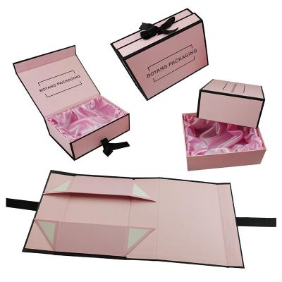 China Recyclable Premium Packaging Ribbon Clothing Paper Box Pink Folding Magnetic Clothing Gift Box for sale