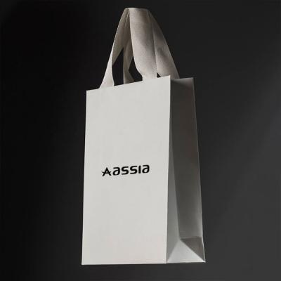 China Wholesale Cheap Price Recyclable Luxury Famous Brand Fashion Clothing Shopping Custom Paper Bag With Logo for sale