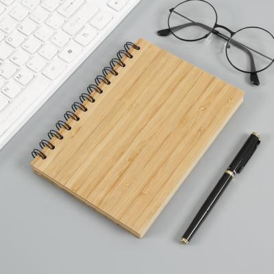 China Custom Wooden Perforated Spiral Notebook Hardcover School Supplies Wood Cover for sale