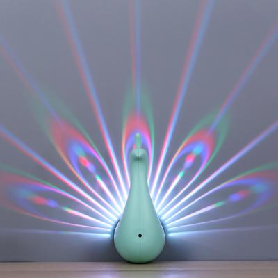 China Lighting Functions Creativity Peacock Projection Lamp Atmosphere LED Bedside Lamp Romantic Warm Light for sale