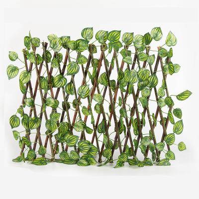 China Life Like 120cm Laurel Plastic Green Artificial Hedge Ivy Leaf Privacy Artificial Boxwood Wicker Fence For Wall Decorate for sale