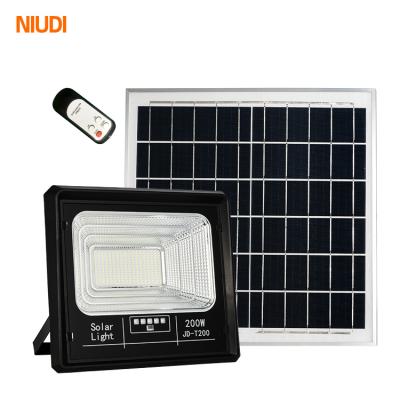 China Niudi Ip65 factory price indoor waterproof solar floodlight 30w 50w 100w outdoor watt led solar flood light for sale