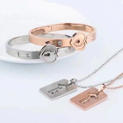 China CLASSIC Stainless Steel Love Lock Bracelet Birthday Gift Concentric Lock Key Pendant Couple Jewelry Set Bangle Necklace Heart Bracelet for sale