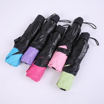 China Wholesale Cheap Solid Color Sun Protection Fashion Solid Color Black Coating Outdoor Women Fold Umbrella for sale