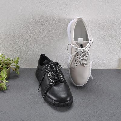 China 2022 Large Size Round Microfiber Fabric Lady Shoes Black Fashion Casual White Flat Sneakers Women for sale