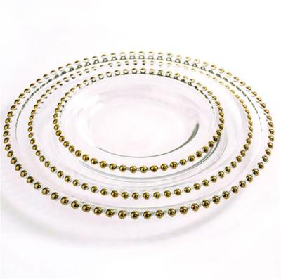 China Sustainable Wholesale Hot Selling Wedding Beaded Plastic Gold Charger Dish Clear Dishes With Gold Rim for sale