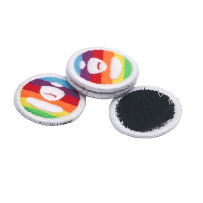 China Handmade top selling custom circle shape brand logo embroidery thread laser cut embroidery patch labels for sale