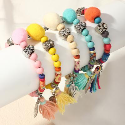 China New elephant leaf elephant tassel antique silver national style cute handmade colorful wooden bead bracelet for sale