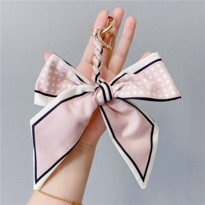 China New Daily Life Color Hand - Woven Head Scarf Bow Car Buckle Horseshoe Bag Ribbon Bow Pendant for sale