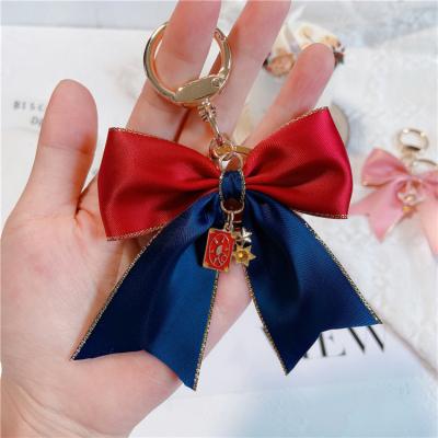 China Daily Life Beautiful Korean Bow Girl Key Chain Ring Bag Pendant Magic Stick Car for sale